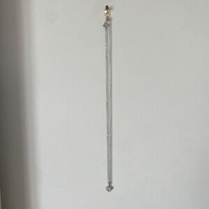 Silver necklace with heart charm and gem